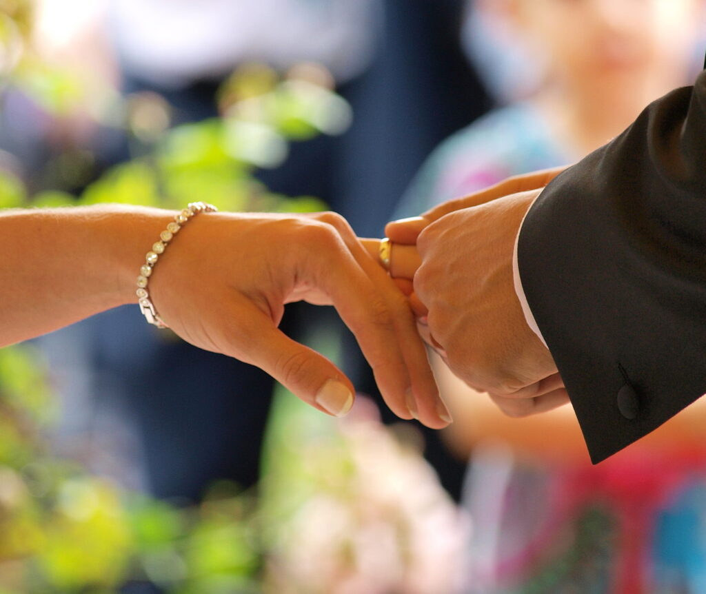 Premium Photo | Wedding ceremony or engagement concept. wedding rings  exchange. groom and bride.