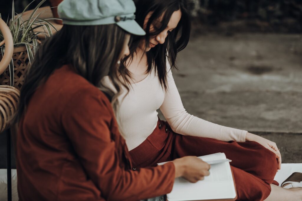 Woman reading to her friend